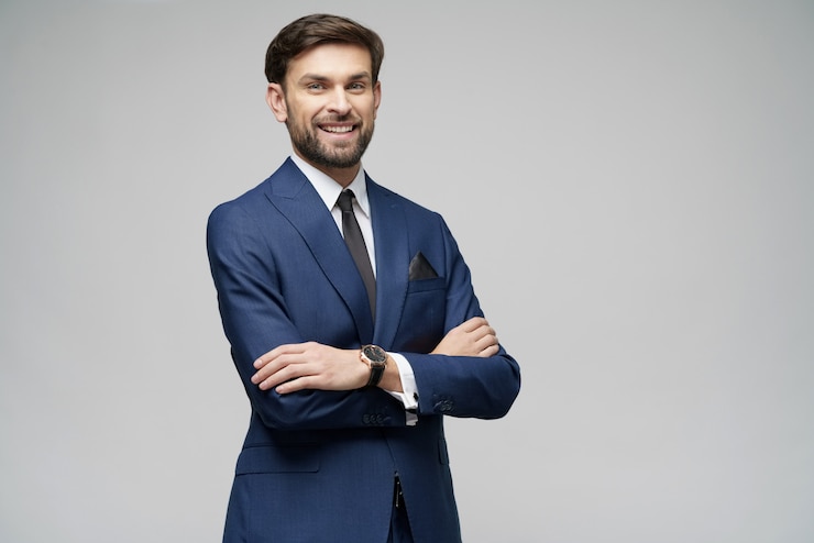 Photo studio photo of young handsome stylish businessman wearing suit