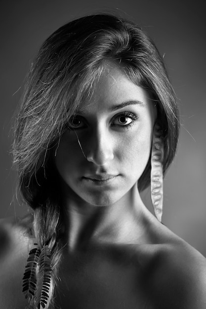 Studio portrait of a beautiful girl wearing a seed for earring