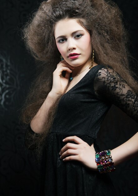 Studio portrait of beautiful woman in black dress