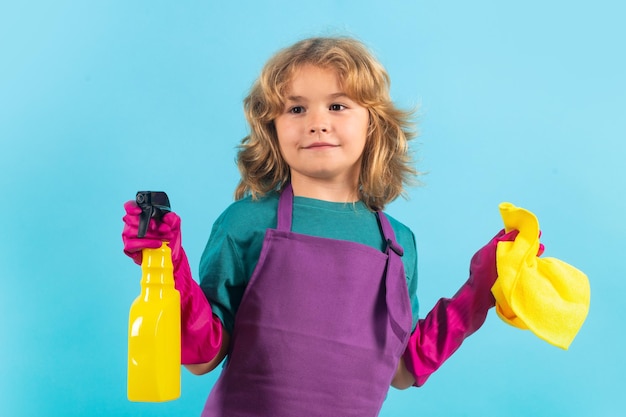 Photo studio portrait of child helping with housework cleaning the house housekeeping home chores