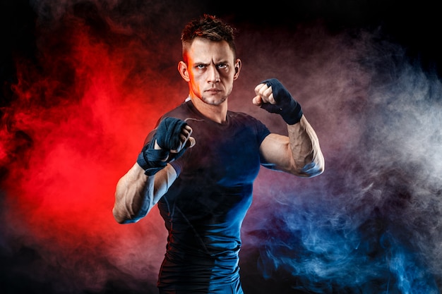 Studio portrait of fighting muscular man