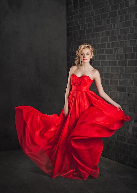 Studio portrait of the girl in a red dress 3324