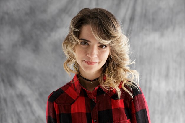 Photo studio portrait of happy girl on gray background