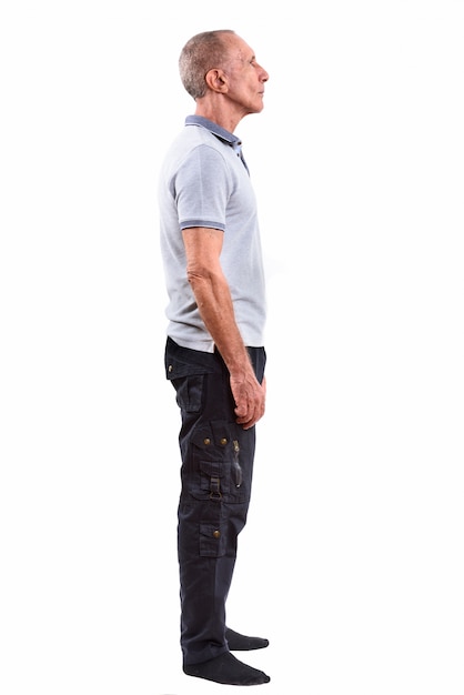 Studio portrait of senior man with short hair isolated against white