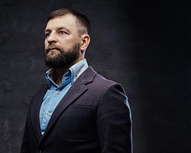 Studio portrait of a successful businessman wearing a suit