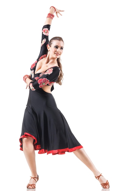 Studio portrait of young attractive woman dancing flamenco