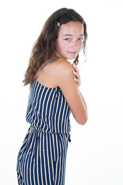 Studio portrait of young happy cute brunette long hairs teenage girl smiling