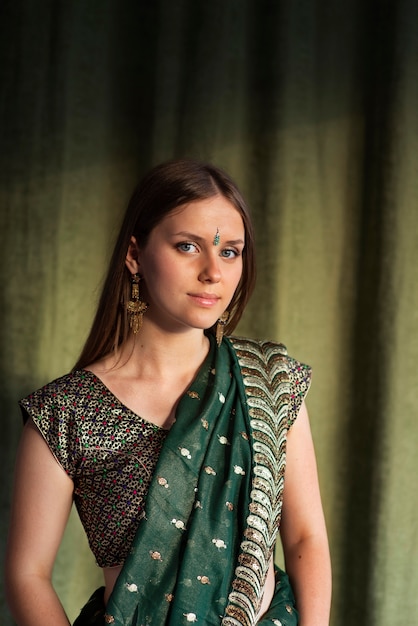 Studio portrait of young woman wearing a traditional sari garment