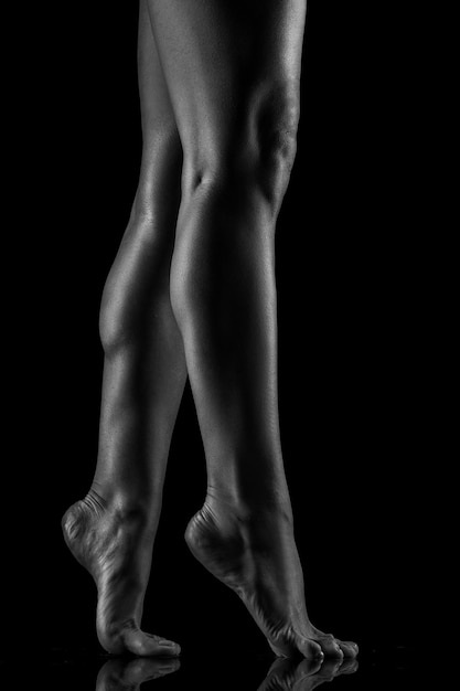 Studio shooting with backlight Sexy body healthy female body concept in black and white