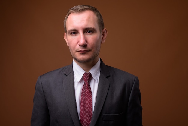 Studio shot of businessman on brown