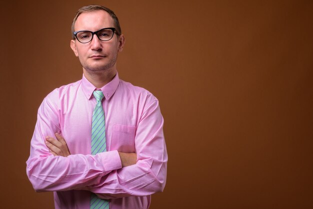 Studio shot of businessman on brown