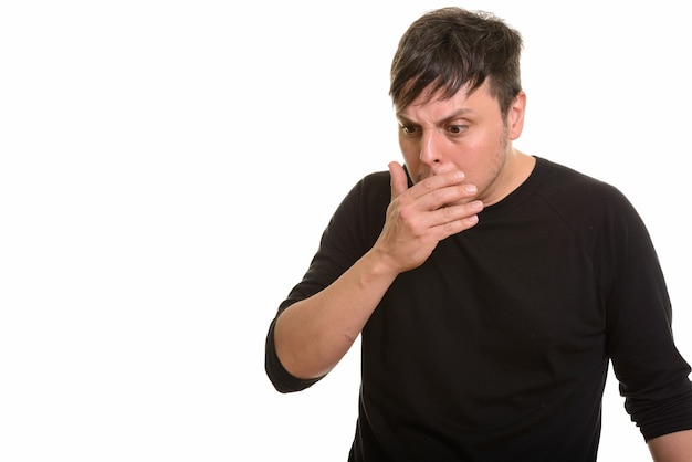 Photo studio shot of caucasian man looking shocked