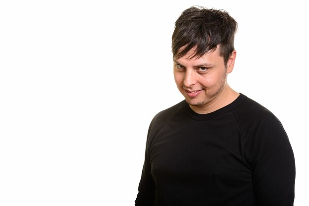 Studio shot of crazy Caucasian man smiling