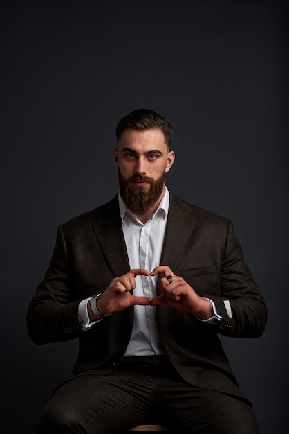 Studio shot of handsome businessman against black space