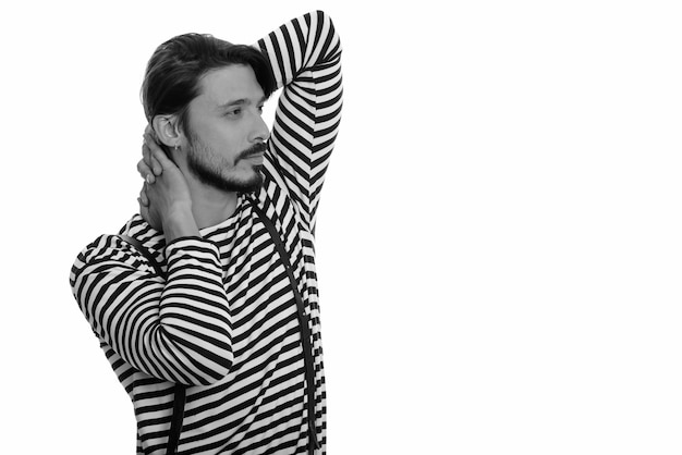 Studio shot of handsome man posing while thinking