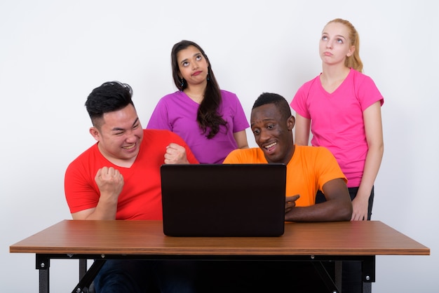 Studio shot of happy diverse group of multi ethnic friends smiliing