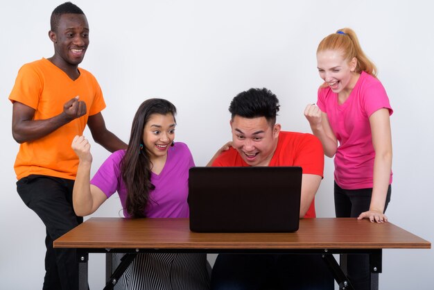 Studio shot of happy diverse group of multi ethnic friends smiling