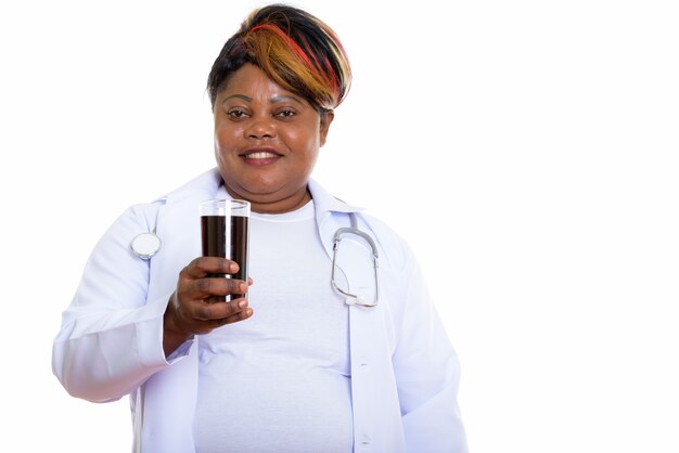 Studio shot of happy woman doctor smiling