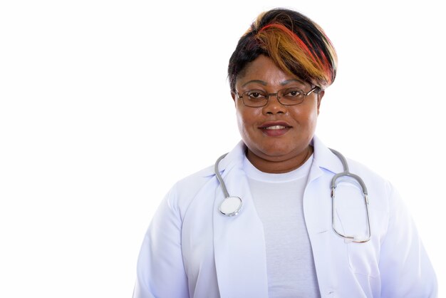 Studio shot of happy woman doctor smiling