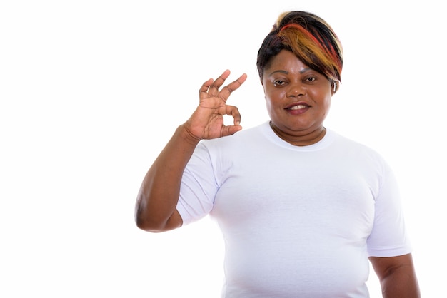 Studio shot of happy woman smiling