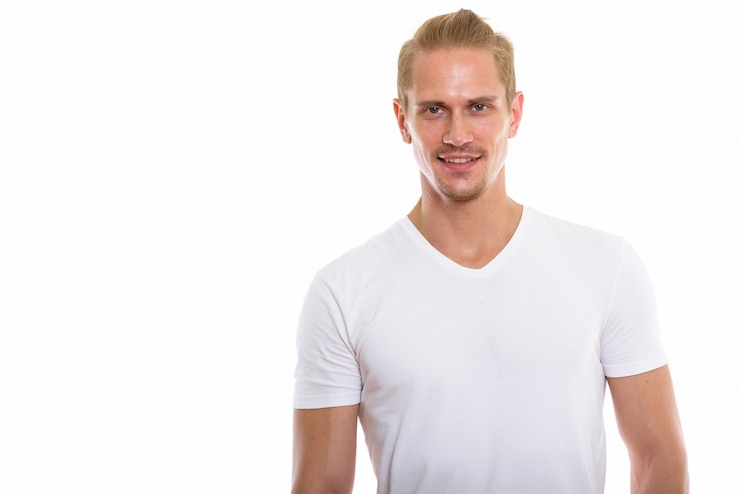 Photo studio shot of happy young handsome man smiling