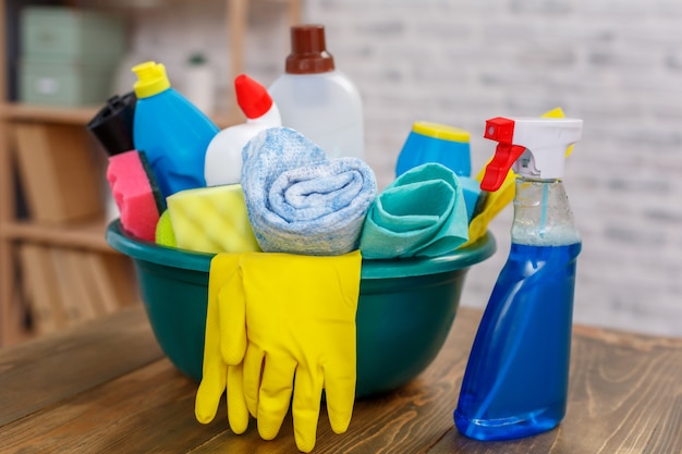 Studio shot of housekeeper's objects. There is bowl full of bottles with disinfectant