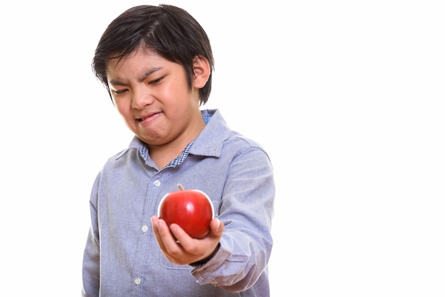 Studio shot of Japanese boy isolated against white background