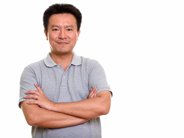 Studio shot of Japanese man isolated against white background