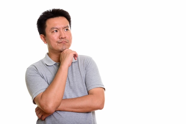 Studio shot of Japanese man isolated against white background