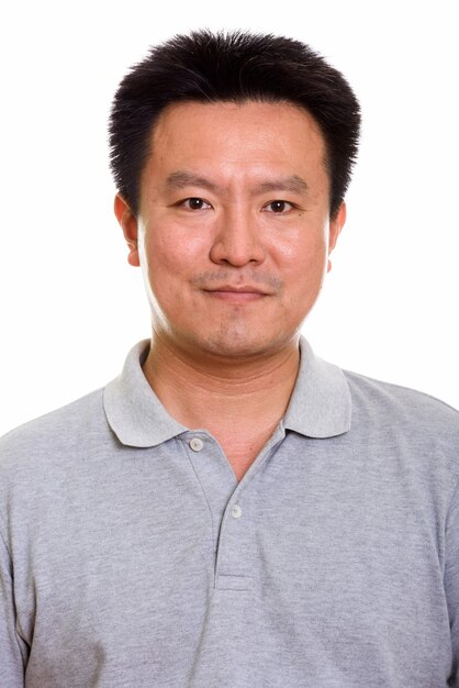 Studio shot of Japanese man isolated against white background