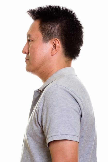 Studio shot of Japanese man isolated against white background