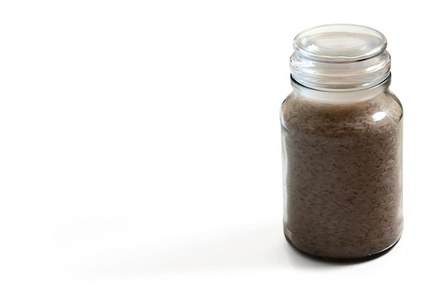 Studio shot of a jar of Jasmine rice on white background