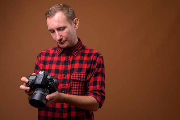 Studio shot of man on brown