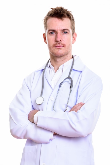 Studio shot of man doctor with arms crossed