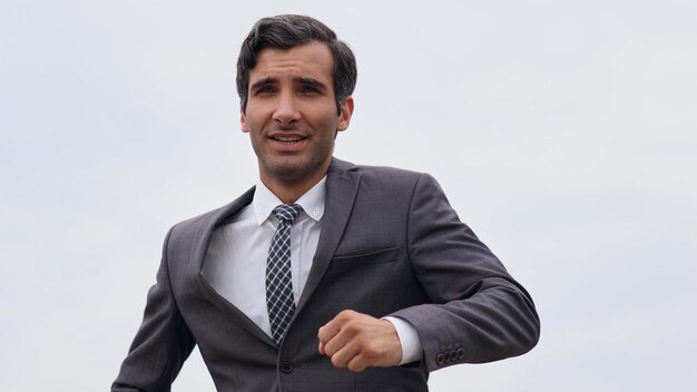 Studio shot of a mature businessman running with a briefcase