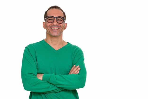 Studio shot of mature handsome Persian man isolated against white background