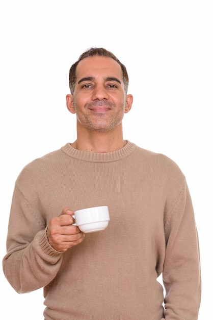 Studio shot of mature handsome Persian man isolated against white background