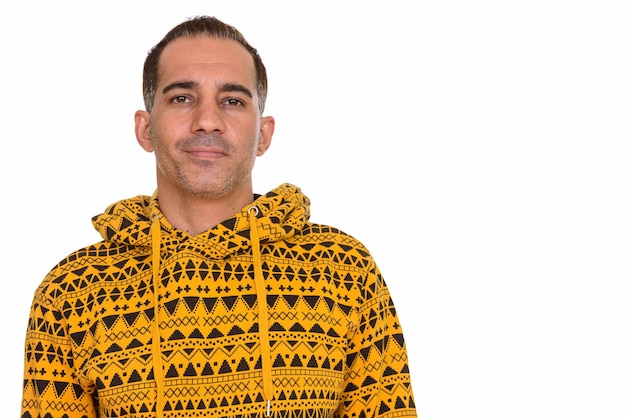 Photo studio shot of mature handsome persian man isolated against white background