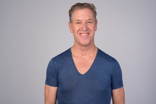 Studio shot of mature man against white background