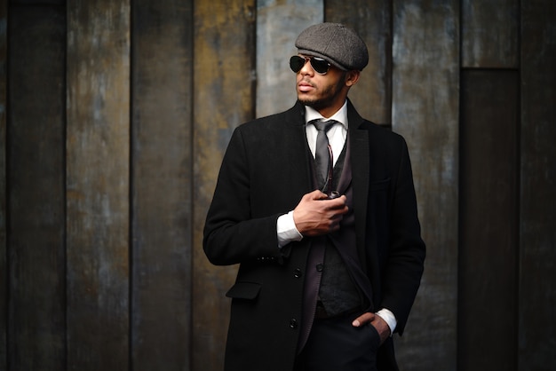 Studio shot of stylish man wearing a coat