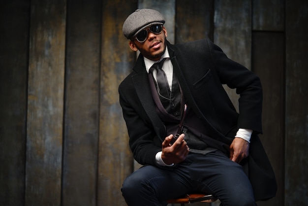 Studio shot of stylish man wearing a coat