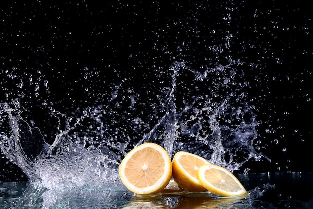 Studio shot with freeze motion of lemon in water splash