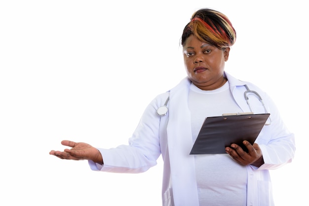 Studio shot of woman doctor holding clipboard