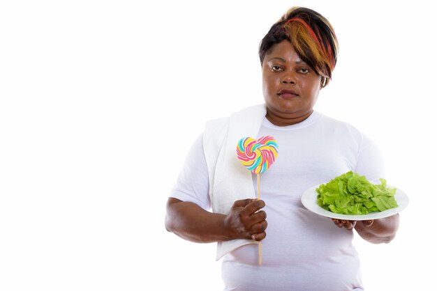 Studio shot of woman holding lettuce