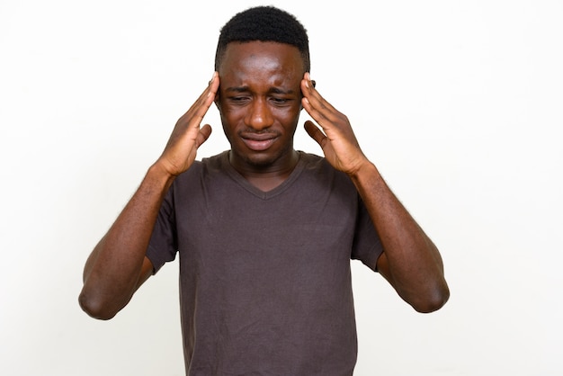 Studio shot of young African man isolated against white background