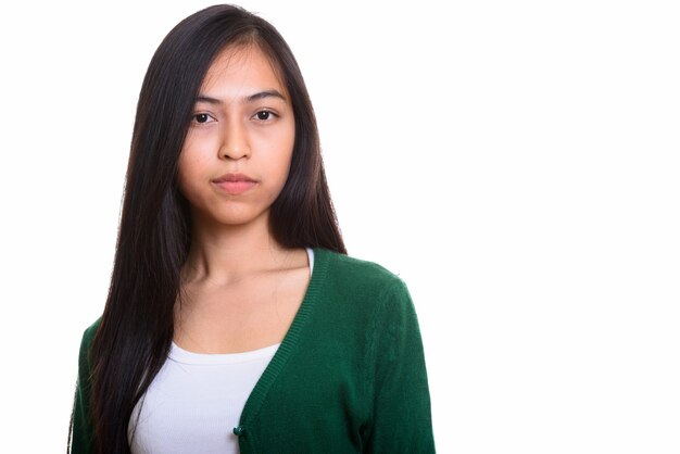 Studio shot of young Asian teenage girl