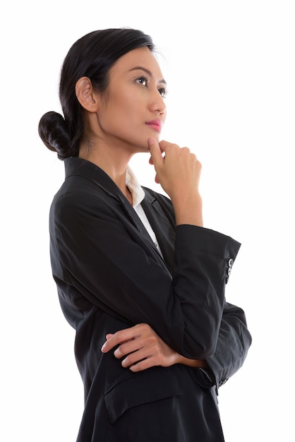 Studio shot of young beautiful Asian businesswoman