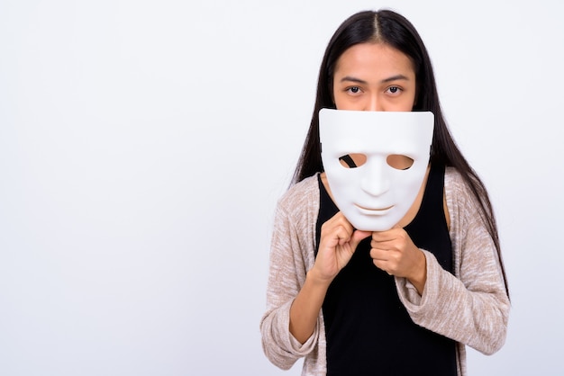 Photo studio shot of young beautiful asian woman against white background