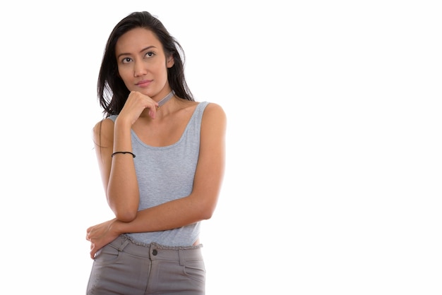 Studio shot of young beautiful Asian woman