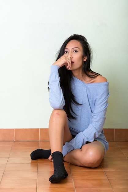 Studio shot of young beautiful Asian woman